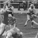 The Patriots Bull (1970) tackles Tucker Friedrickson of the New York Giants (left), blocking a pass from the Redskins' Sonny Jourgenson (right).